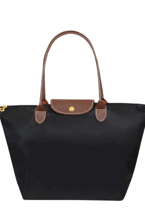 Isabella Lumina black faux leather handbag with spacious design, stylish tote with sturdy handles and interior compartments.
