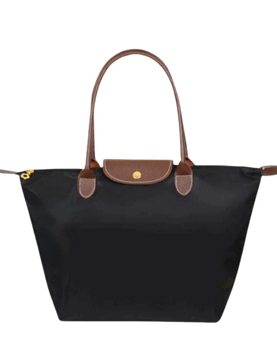 Lumina Wear Isabella black faux leather handbag with spacious interior and chic design, perfect for stylish everyday use.