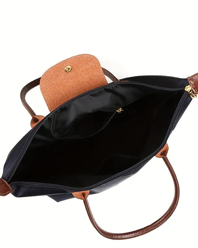 Black faux leather handbag by Lumina Wear, Isabella Chic design with spacious interior for stylish everyday use.
