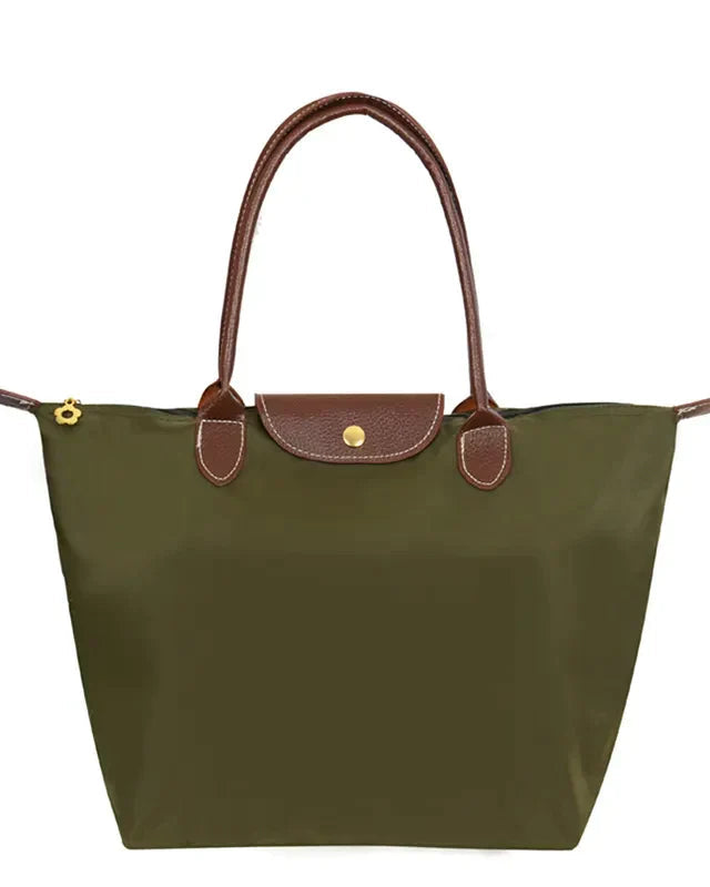 Isabella Lumina black faux leather handbag with spacious interior and chic design, featuring sturdy handles and sleek finish.