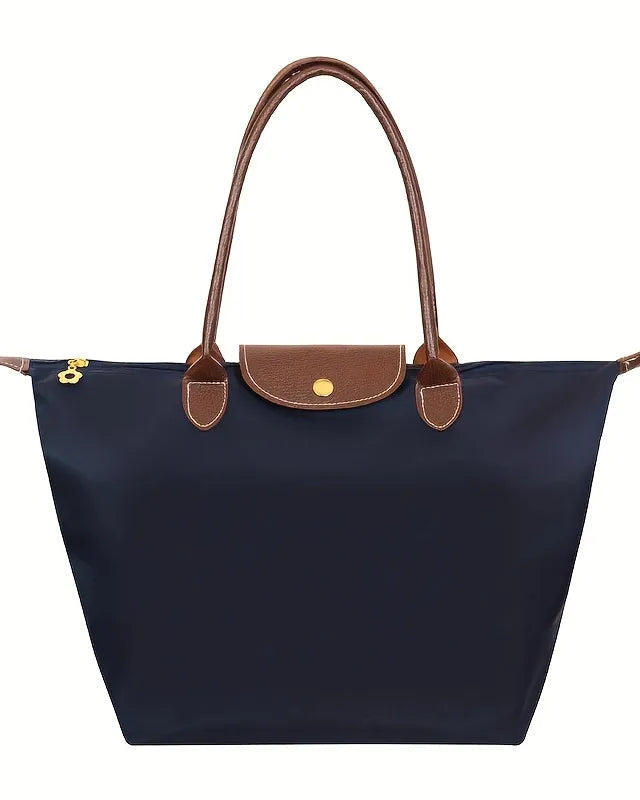 Black faux leather Isabella handbag by Lumina Wear featuring a spacious design and chic style.