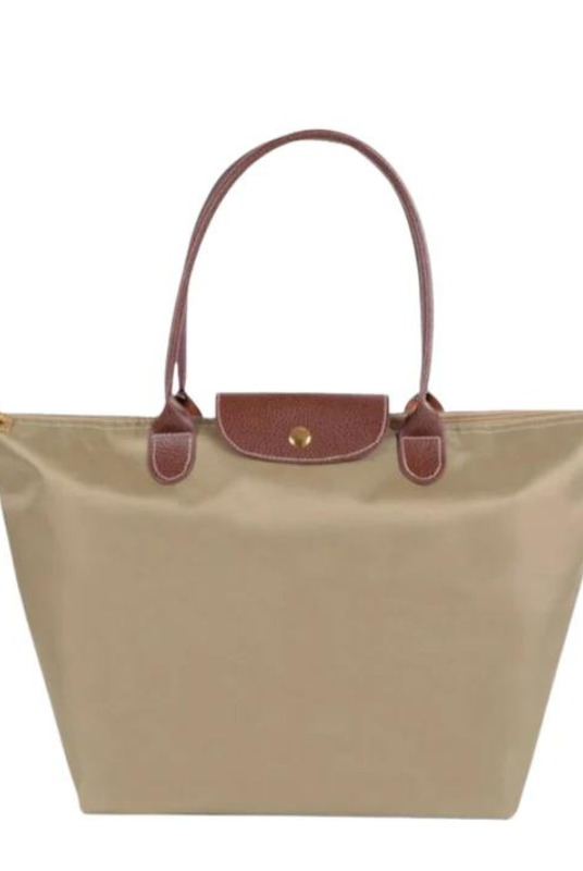 Black faux leather Isabella handbag by Lumina Wear featuring a spacious design and stylish look.