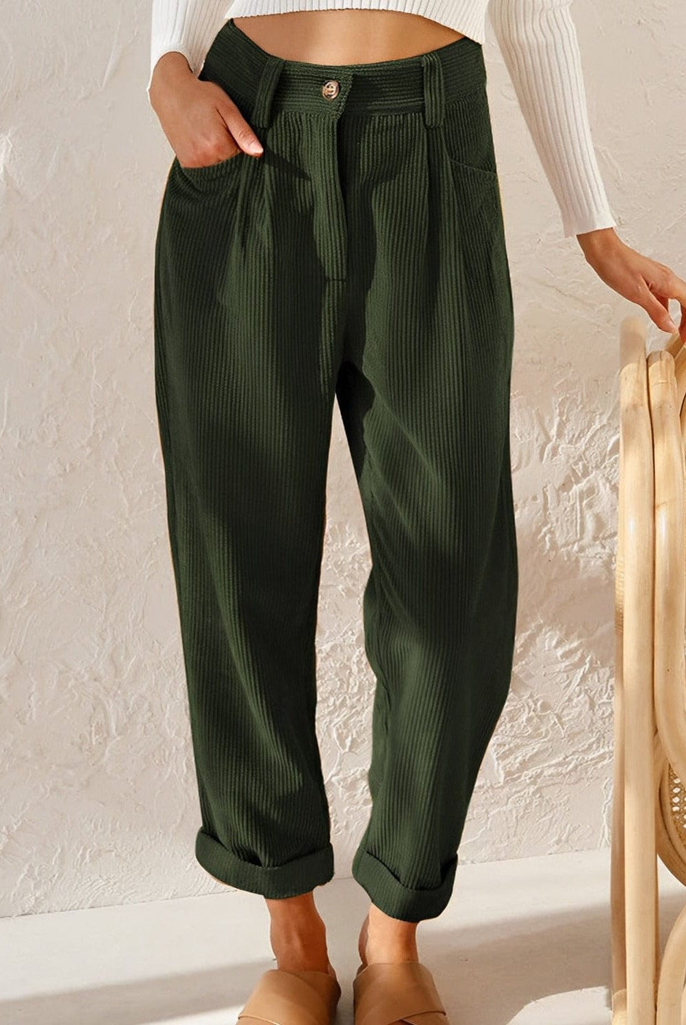 Isabella Lumina Wear brown corduroy trousers with a flattering fit, shown on a model featuring stylish, slim-cut design.
