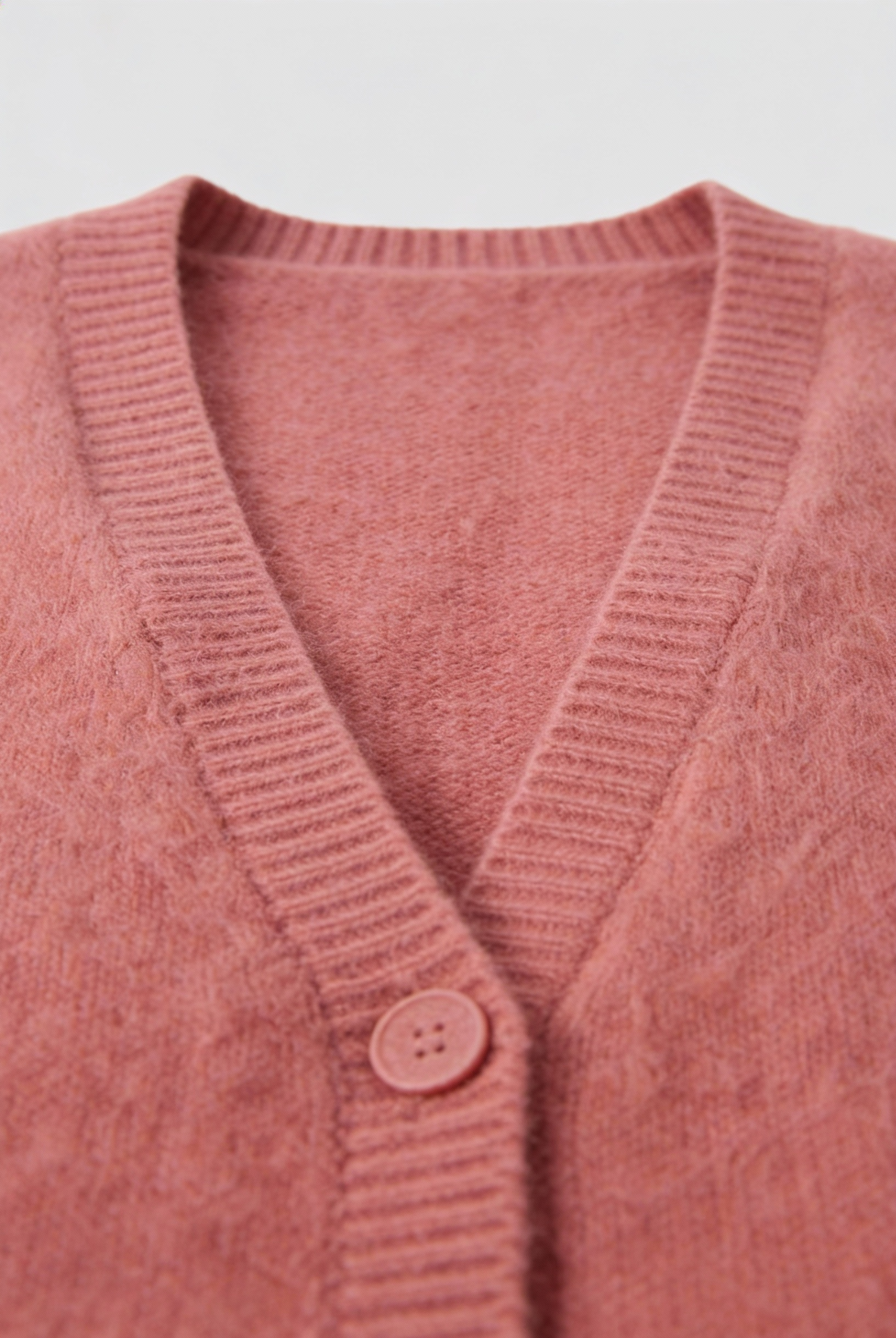Pink knit cardigan sweater by Lumina Wear featuring a cozy, relaxed fit and soft texture, perfect for casual layered looks.
