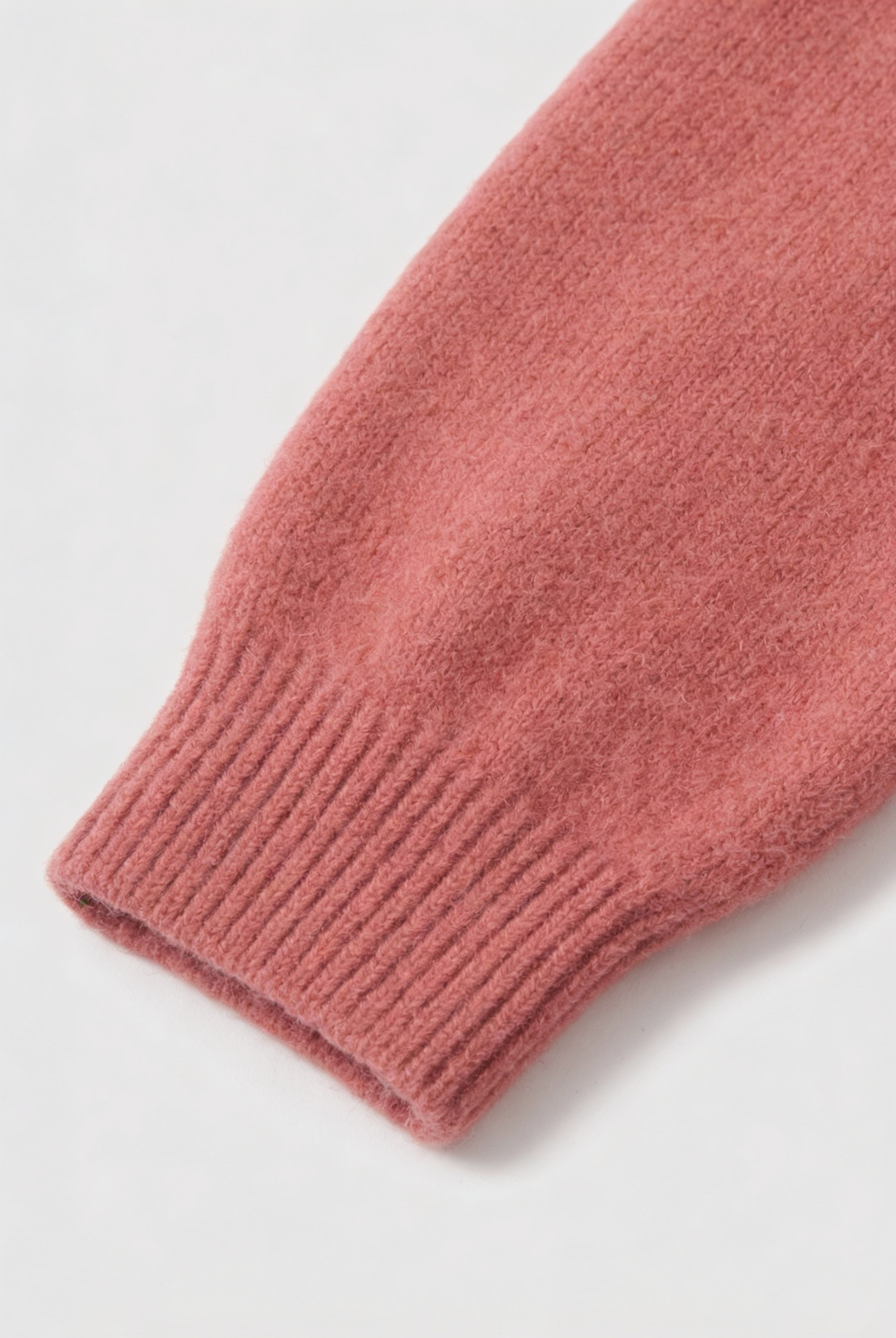 Pink knit cardigan sweater from Lumina Wear with a relaxed fit, featuring cozy texture and stylish design.