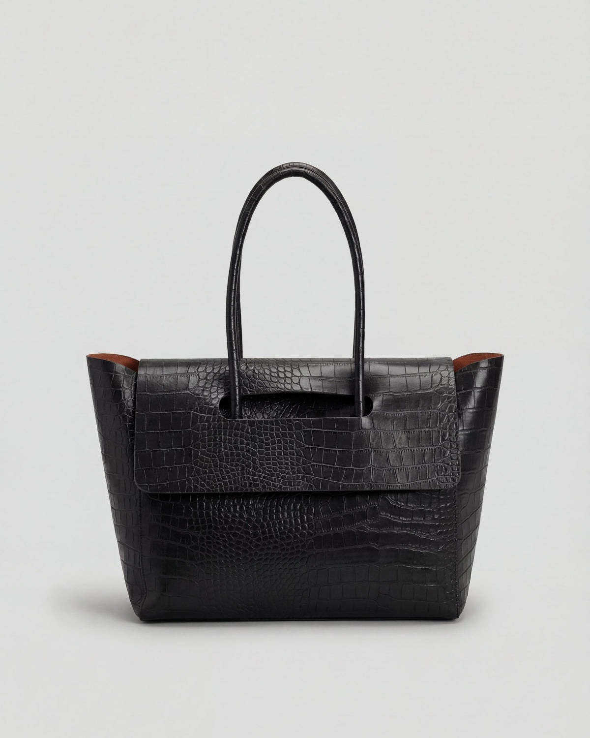 Elegant black crocodile leather handbag by Lumina Wear with adjustable strap, featuring a sophisticated design and spacious interior.
