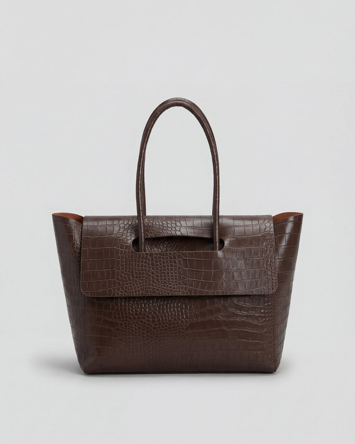Elegant black crocodile leather handbag by Lumina Wear featuring an adjustable strap and structured design.