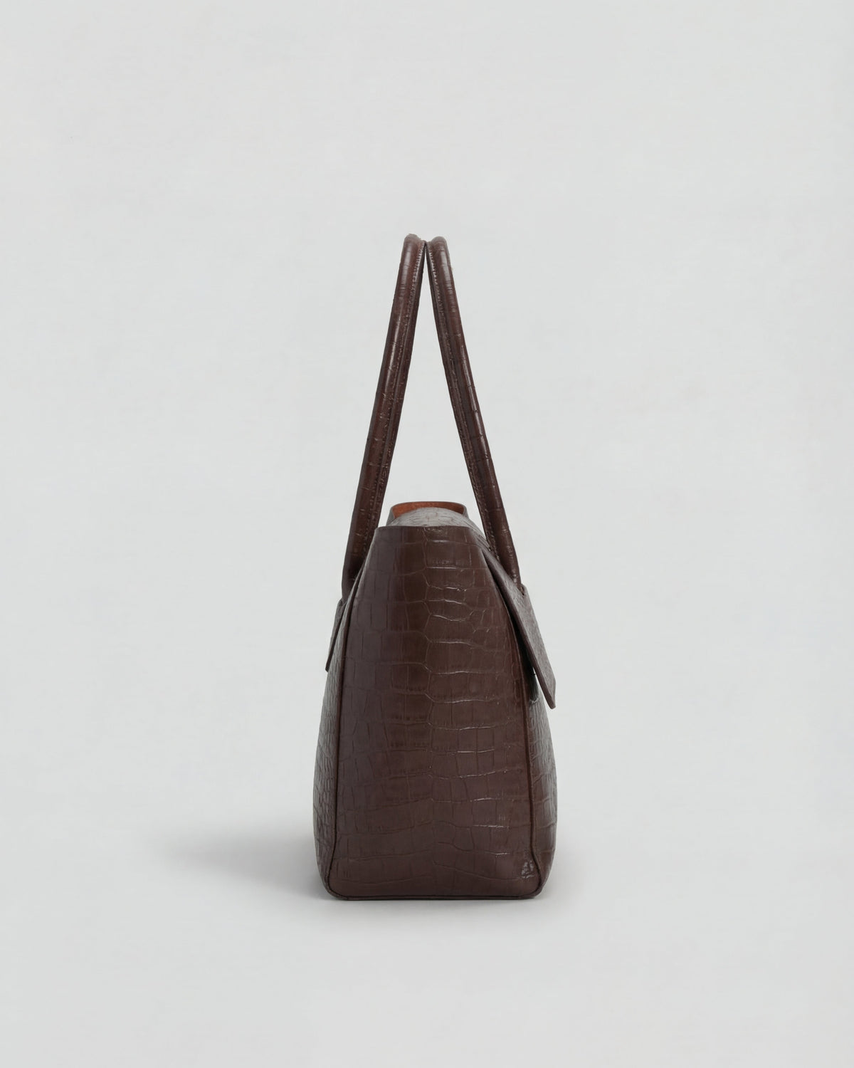 Lumina Wear Isabella black crocodile leather handbag with adjustable strap, stylish and elegant for everyday use.