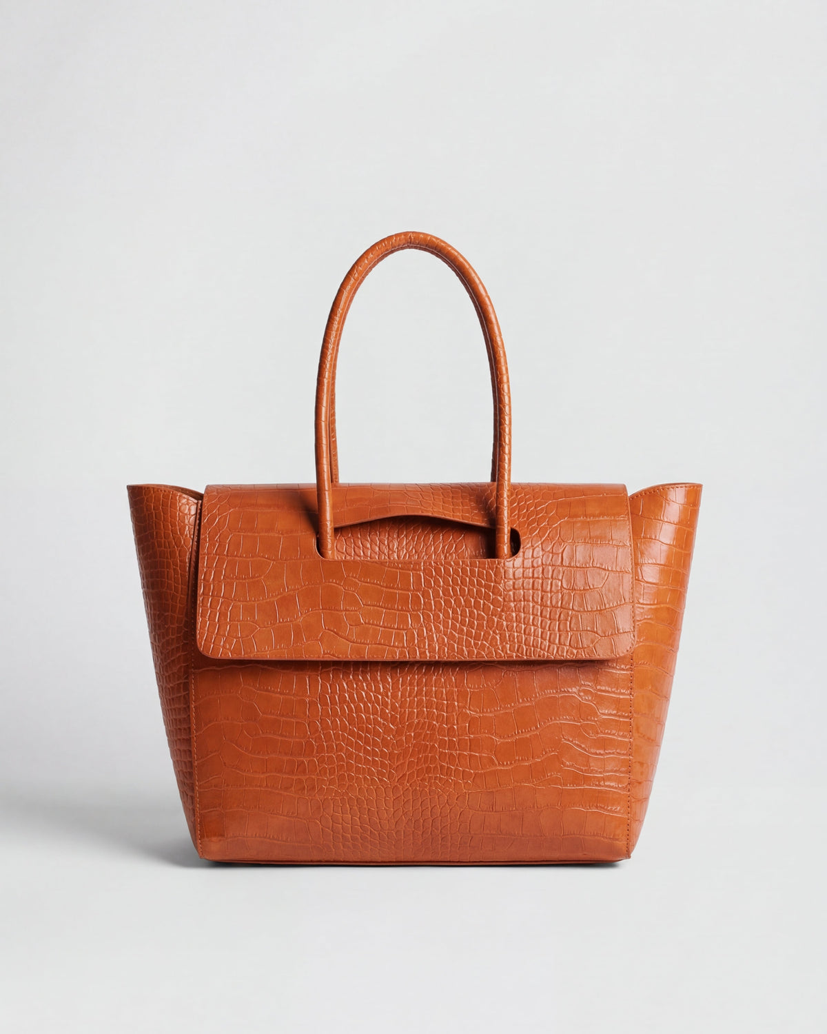 Elegant black crocodile-embossed Lumina Isabella handbag with adjustable strap and sleek design.