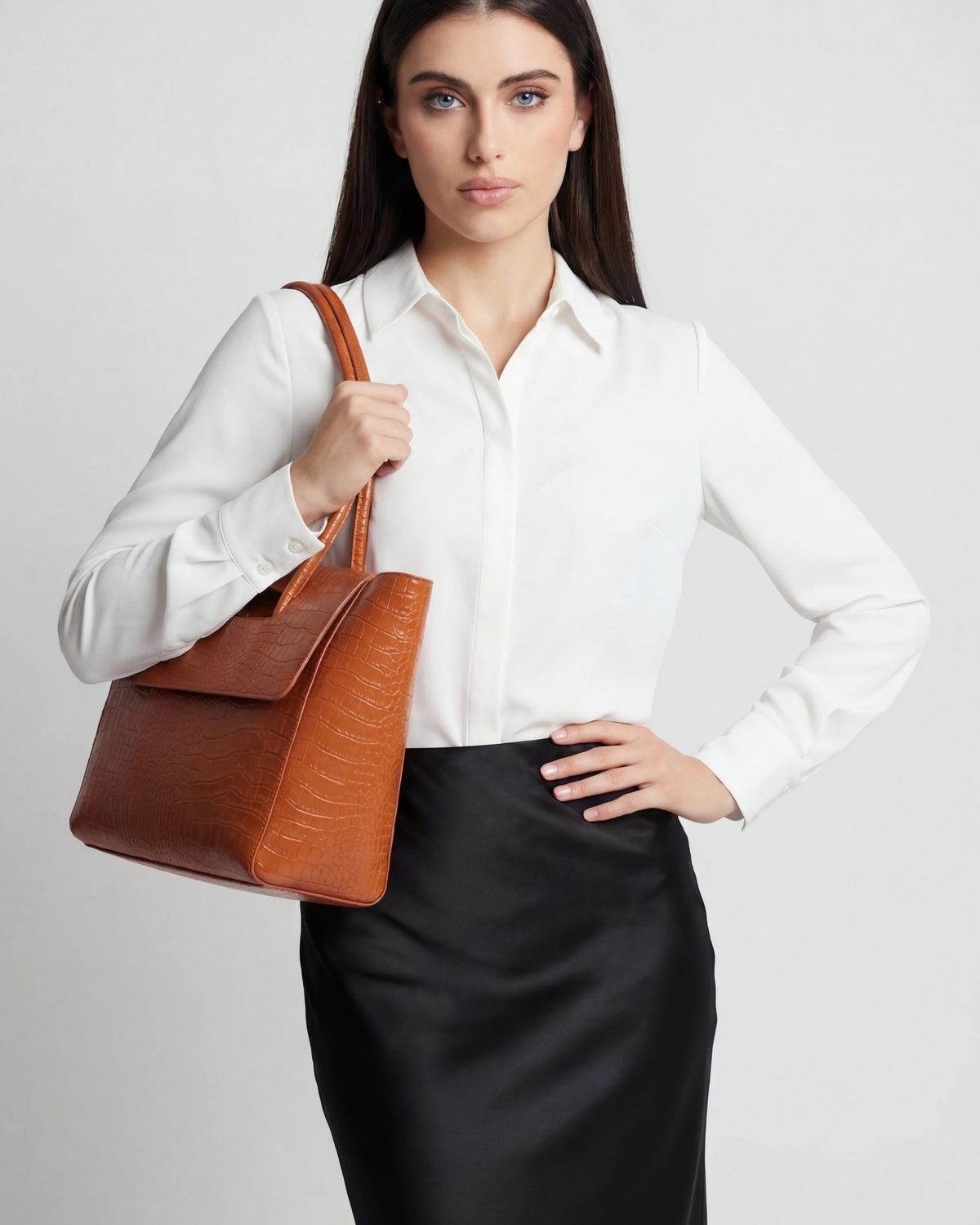 Elegant black crocodile leather handbag with adjustable strap from Lumina Wear, showcasing a stylish and sophisticated design.