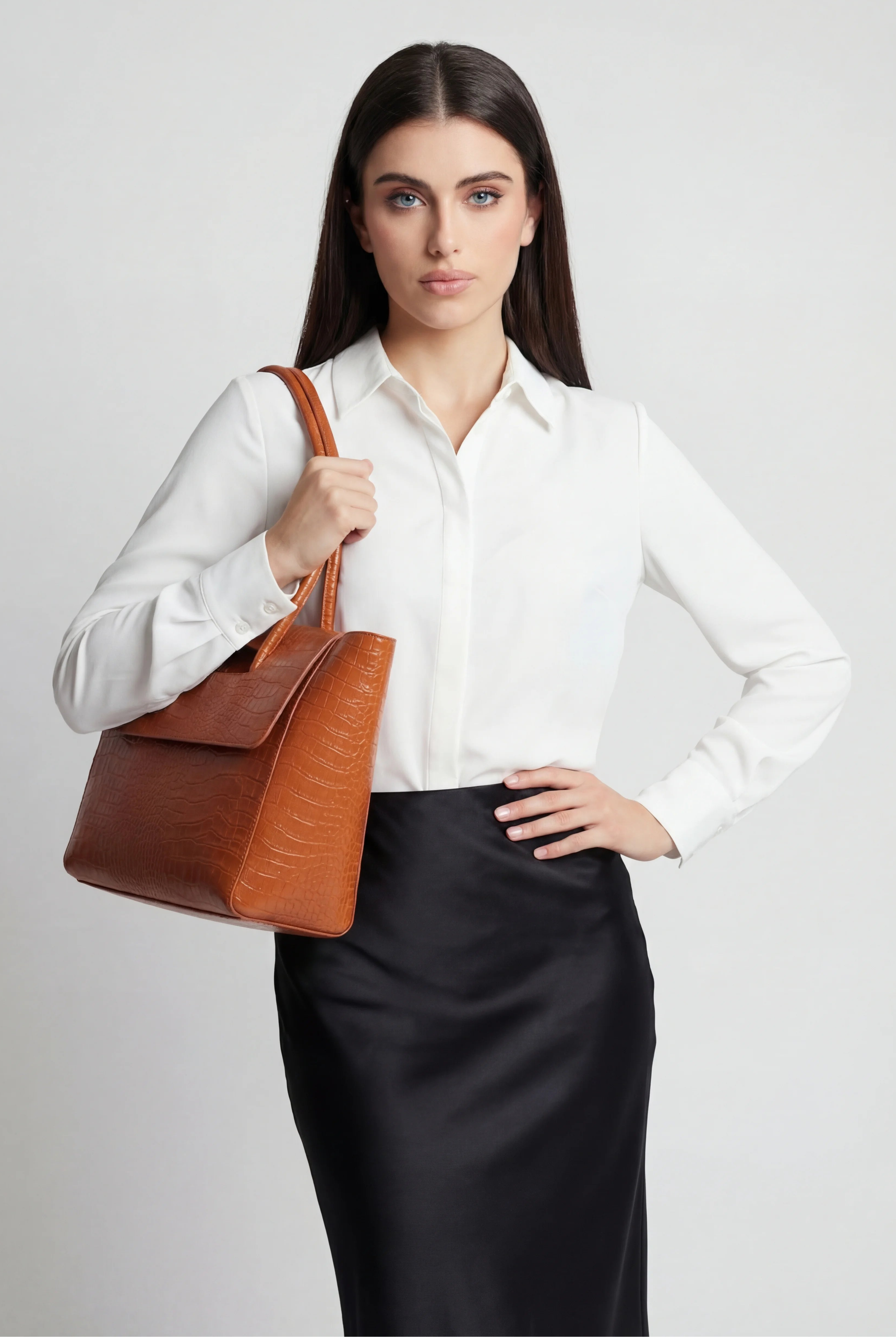Luxurious black crocodile leather handbag by Lumina Wear with adjustable strap, elegant design, perfect for stylish occasions.