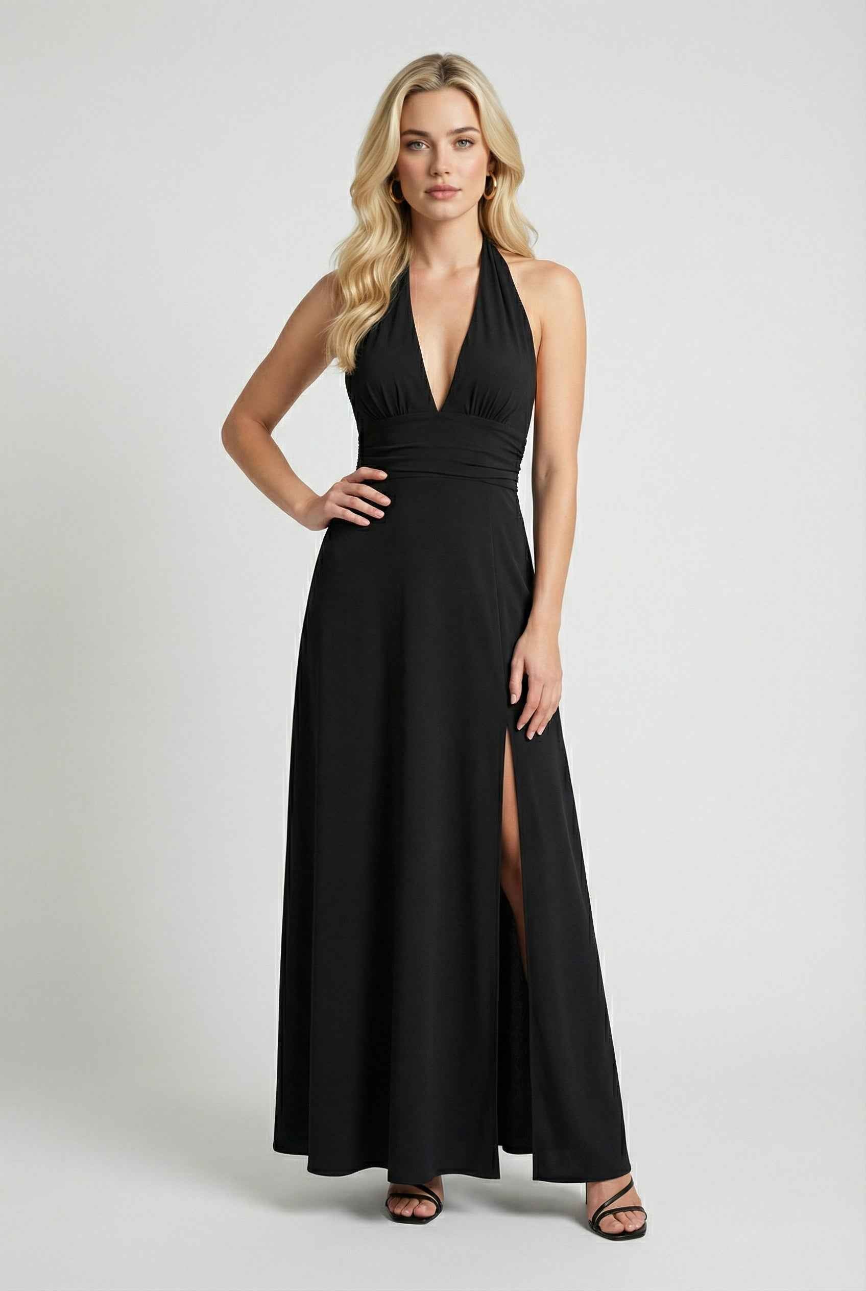 Elegant black halter neck dress by Lumina Wear, featuring a versatile fit and stylish design for special occasions.