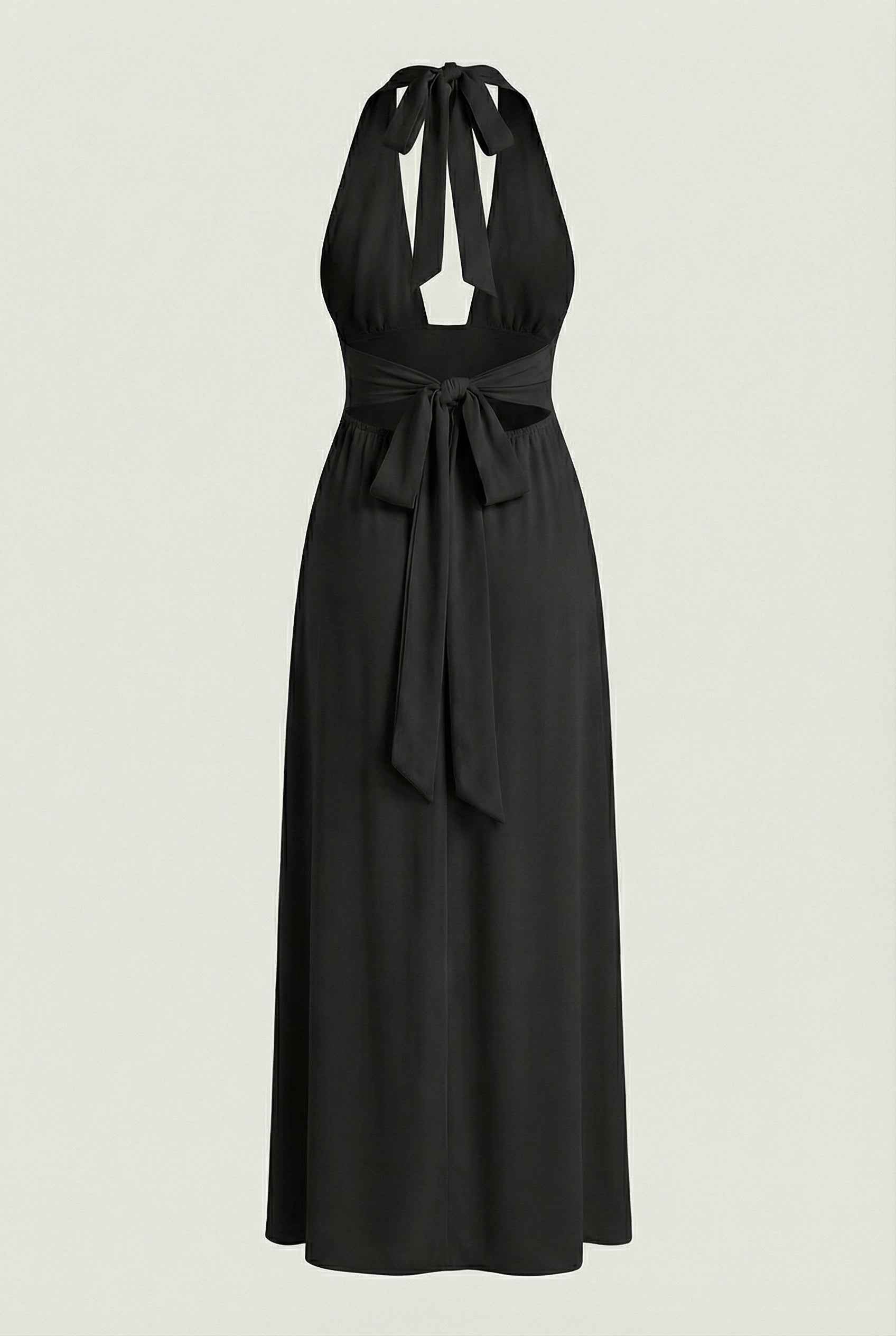 Elegant black halter neck dress by Lumina Wear, showcasing a versatile fit and flowing fabric for stylish occasions.
