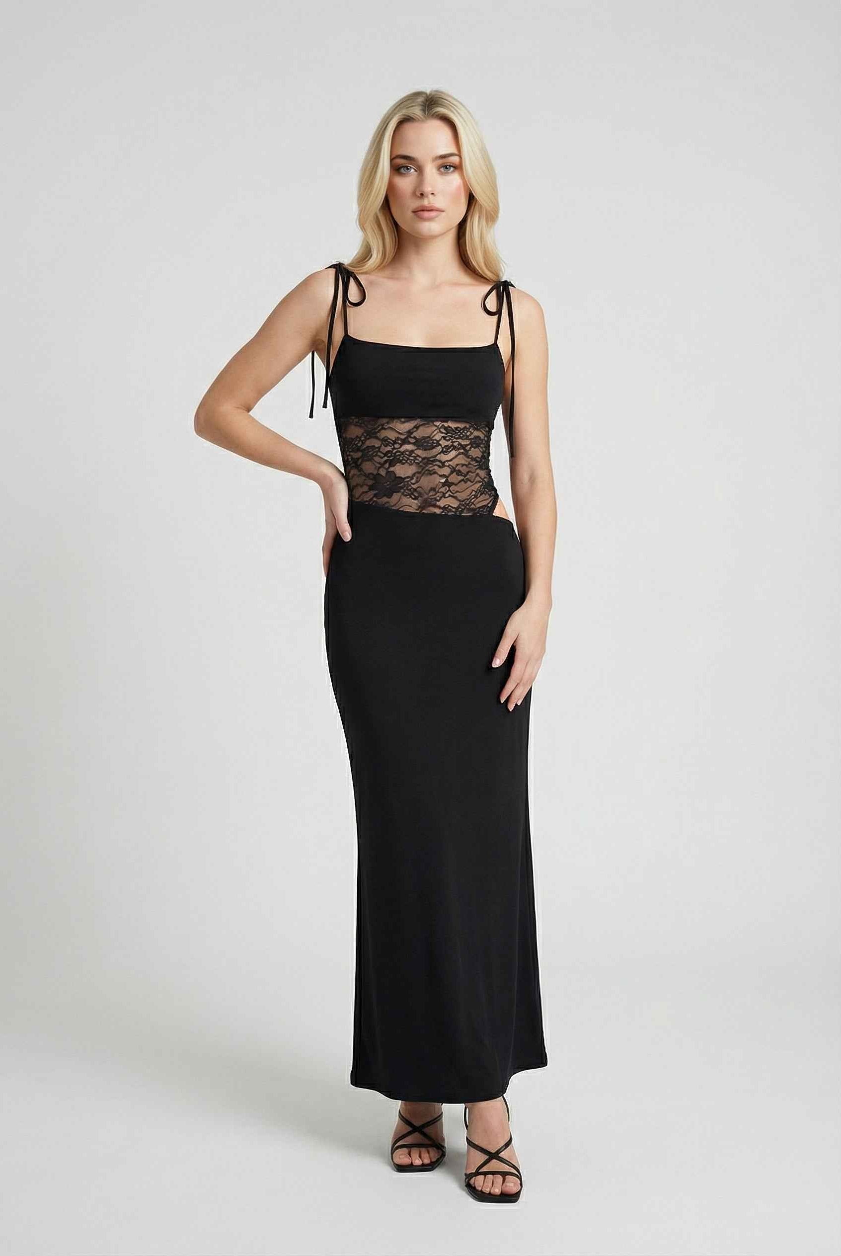 Elegant black lace dress with a flowy design from Lumina Wear, perfect for casual occasions, featuring intricate lace details.