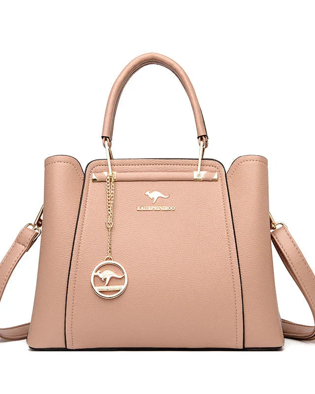 Elegant black leather handbag with gold accents by Lumina Wear, featuring a structured design and sleek handles.