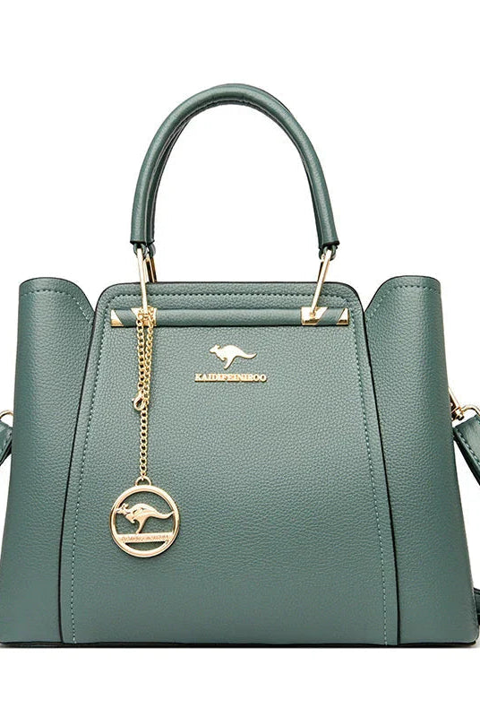 Elegant black leather handbag with gold accents from Lumina Wear's Isabella collection, featuring a sleek and sophisticated design.
