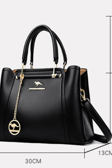 Elegant black leather handbag with gold accents from Lumina Wear's Isabella collection, featuring a sleek design and stylish details.