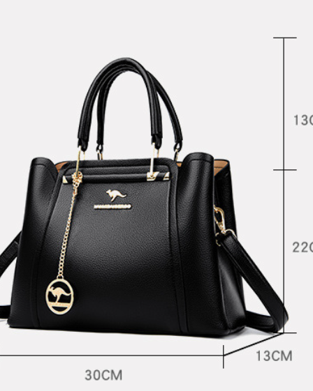 Elegant black leather handbag with gold accents from Lumina Wear, featuring a structured design and stylish hardware.