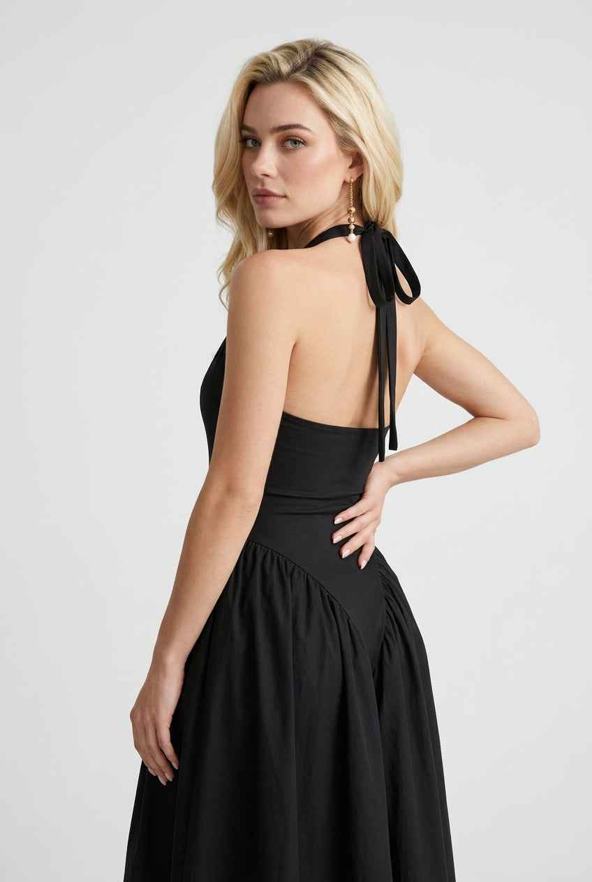 Elegant black midi dress by Lumina Wear featuring a flattering fit, perfect for stylish occasions.