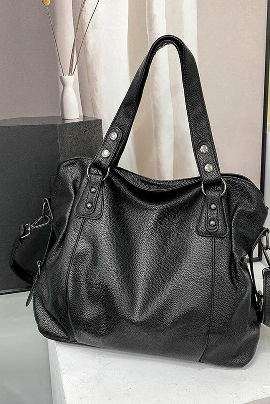 Elegant black synthetic leather tote bag from Lumina Wear, featuring a spacious design and stylish handles for versatile use.