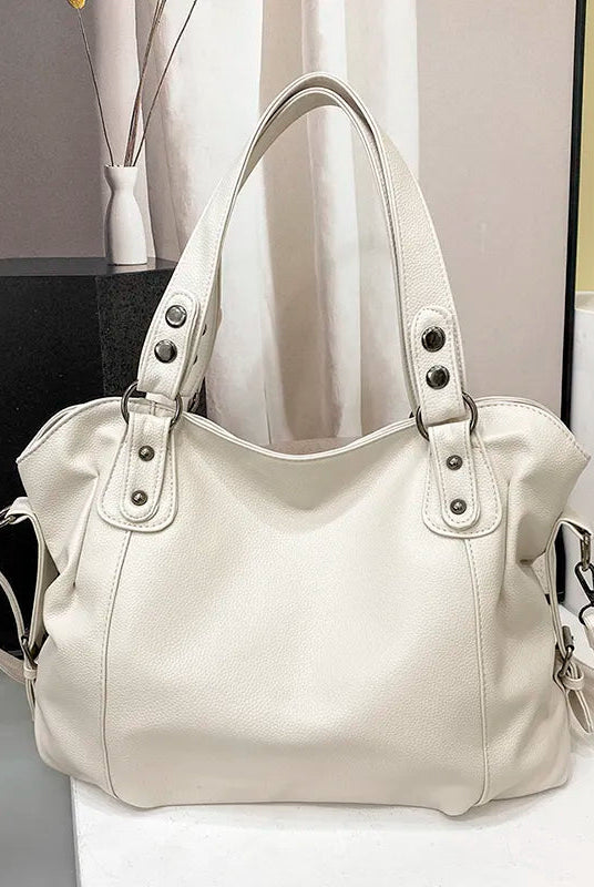 Elegant black synthetic leather tote bag by Lumina Wear, Isabella style, with spacious interior and sleek design.