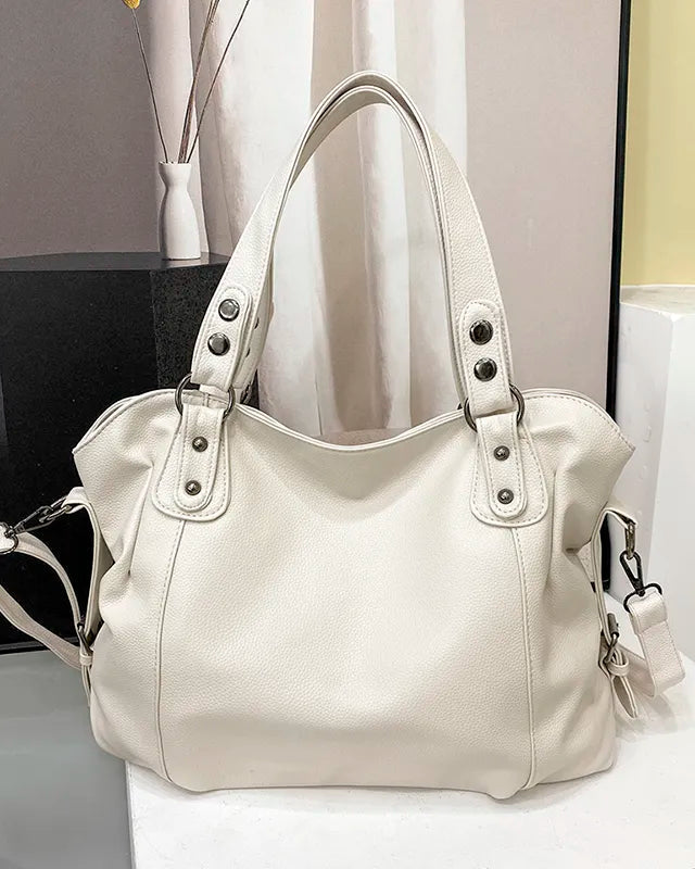Elegant black synthetic leather tote bag by Lumina Wear, featuring a spacious handbag design with sleek handles.