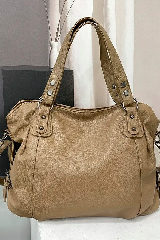Elegant black synthetic leather tote bag from Lumina Wear, featuring a spacious design and sleek hand-held style.