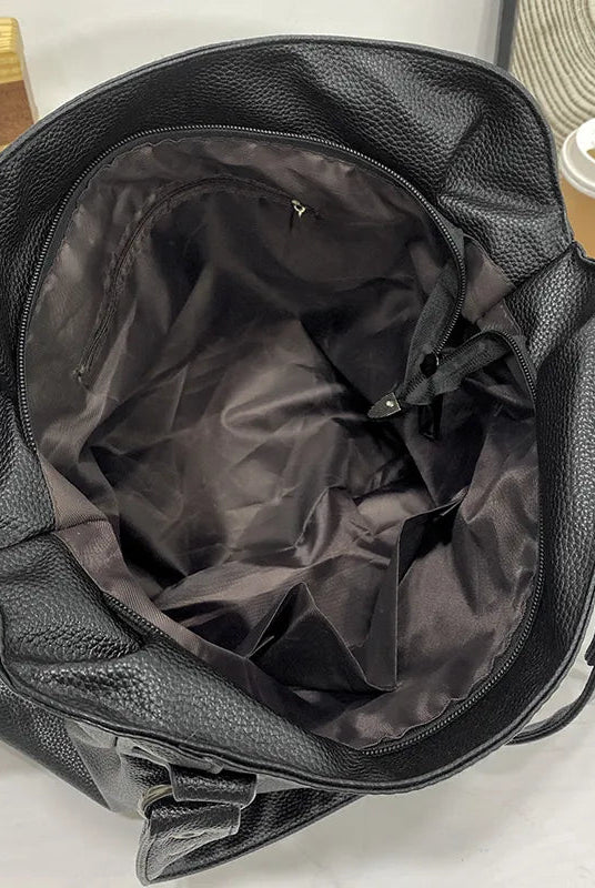 Elegant black synthetic leather tote bag from Lumina Wear, featuring a spacious design and sleek handles for stylish carrying.