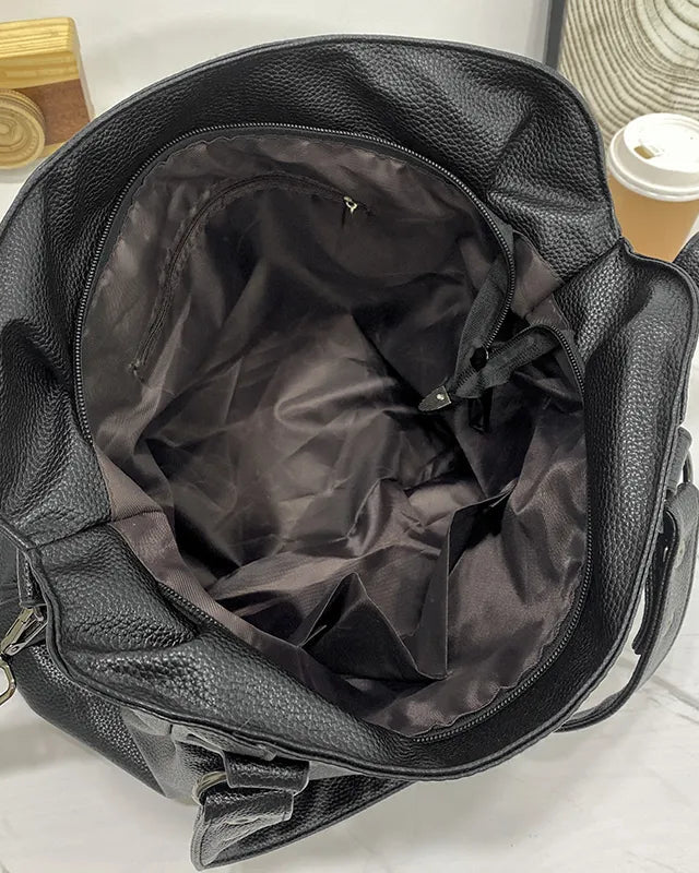 Elegant black synthetic leather tote bag by Lumina Wear, showcasing a spacious handbag with sleek design and sturdy handles.