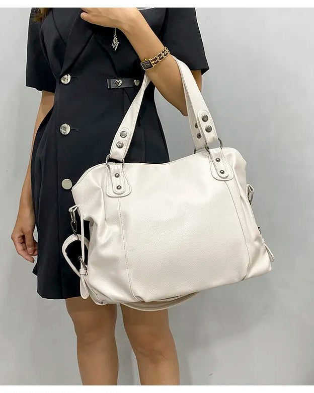 Elegant black synthetic leather tote bag from Lumina Wear, featuring a stylish design and spacious interior.