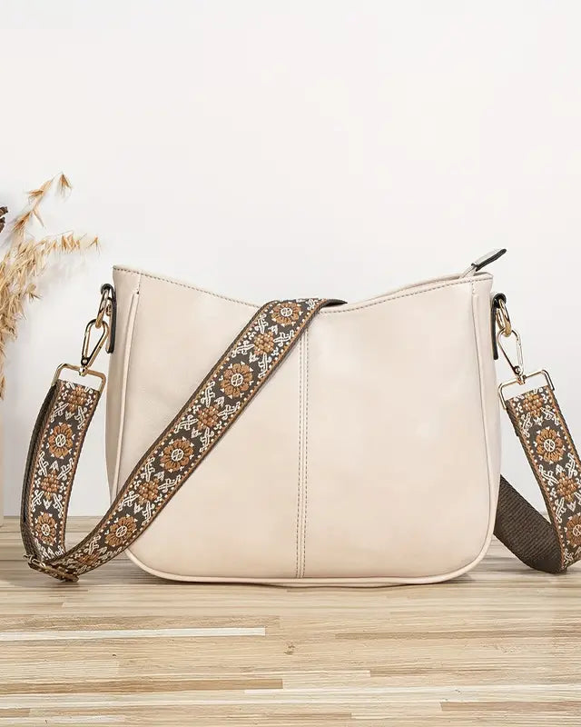 Elegant black vegan leather shoulder bag by Lumina Wear featuring an adjustable strap and stylish design.