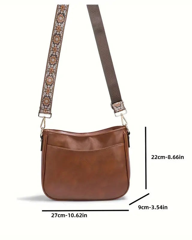 Elegant black vegan leather shoulder bag by Lumina Wear featuring an adjustable strap and stylish design.