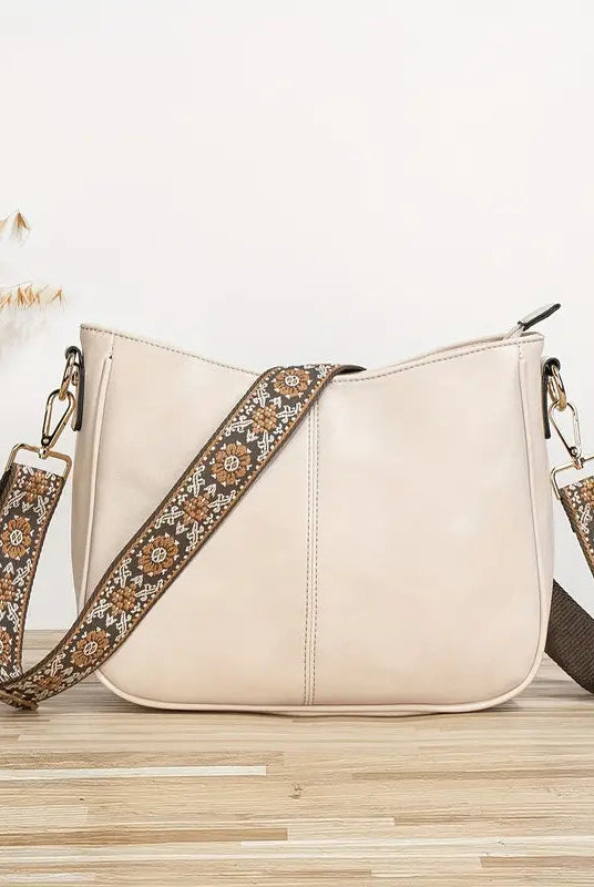 Elegant black vegan leather shoulder bag by Lumina Wear featuring an adjustable strap and sleek design.