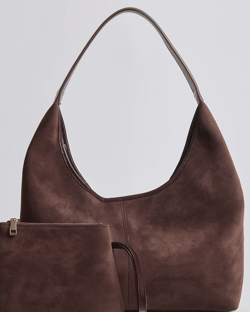 Elegant black vegan suede tote bag from Lumina Wear with sleek design, spacious interior, and sturdy handles.