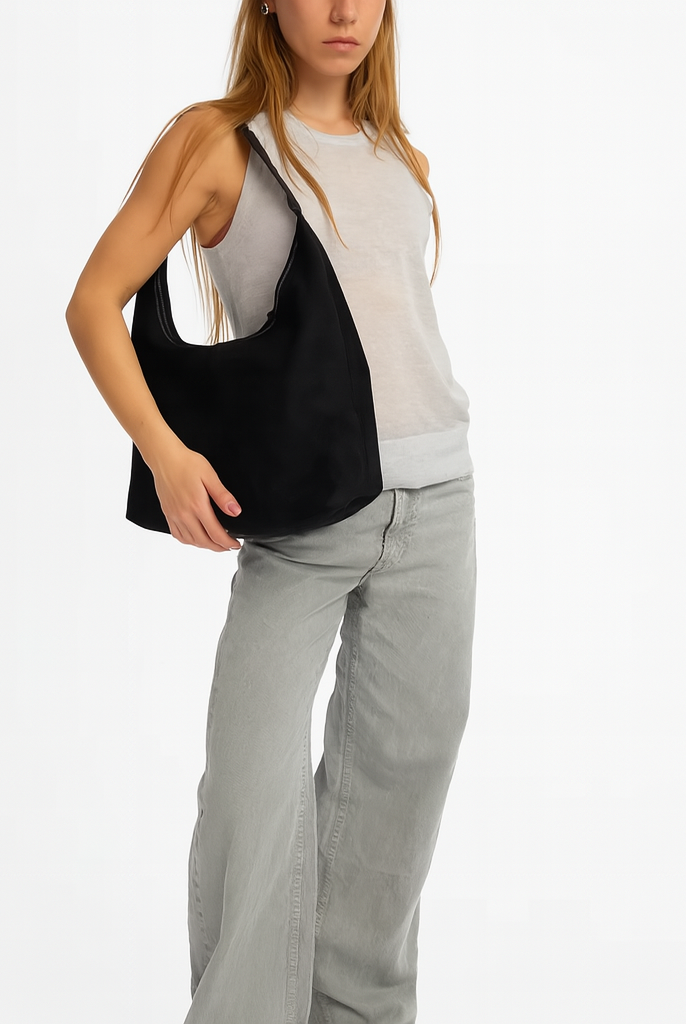 Elegant black vegan suede tote bag from Lumina Wear, featuring a spacious design and sleek handles for stylish everyday use.