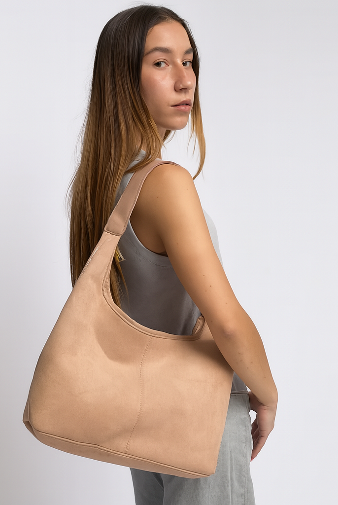 Elegant black vegan suede tote bag by Lumina Wear, featuring a spacious design and sturdy handles on a white background.