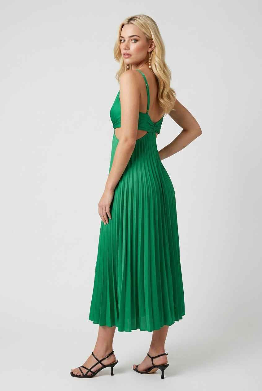 Elegant green pleated maxi dress by Lumina Wear with flowing design, showcased on a model in a natural outdoor setting.