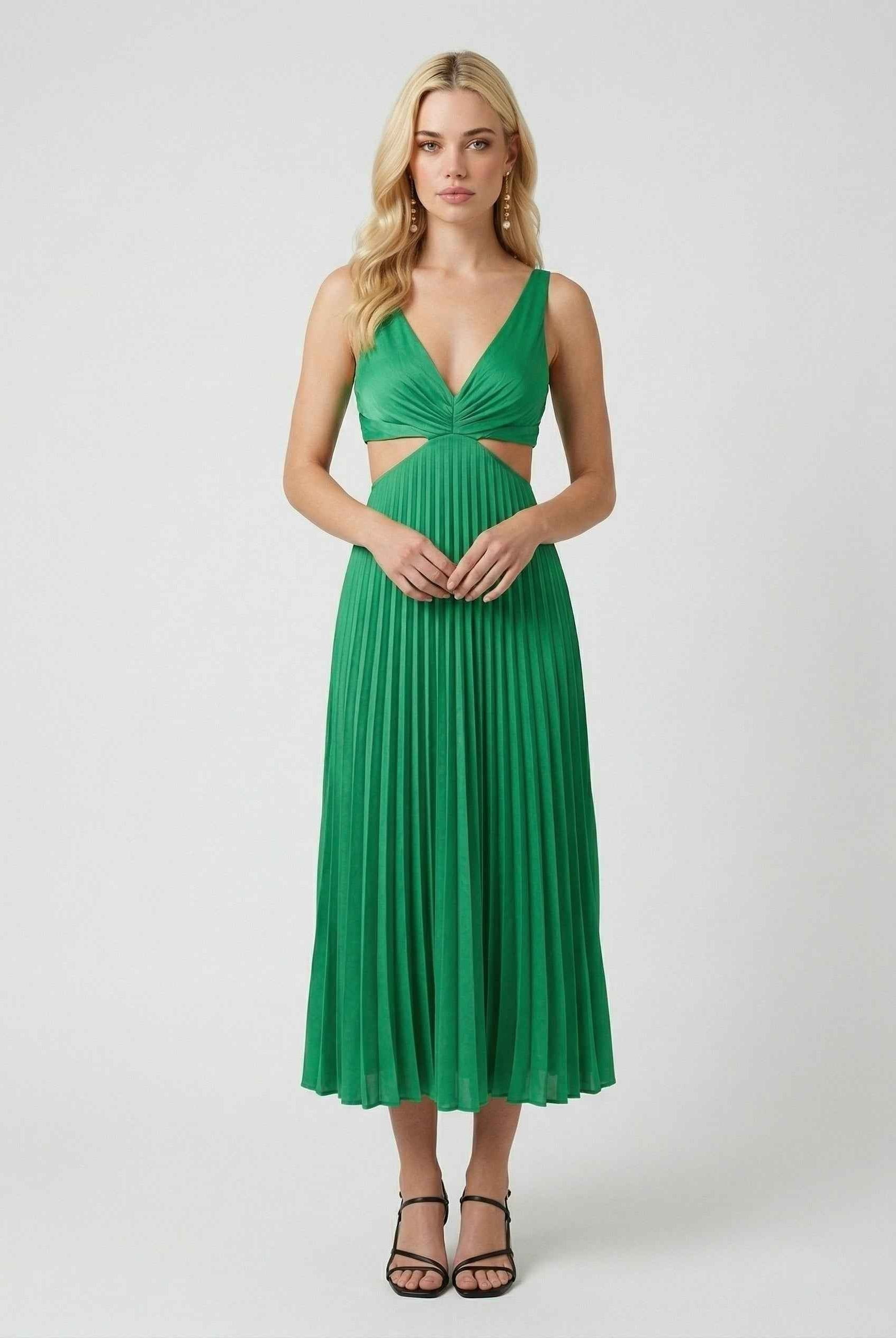 Elegant green pleated maxi dress by Lumina Wear featuring flowing design and sophisticated style.