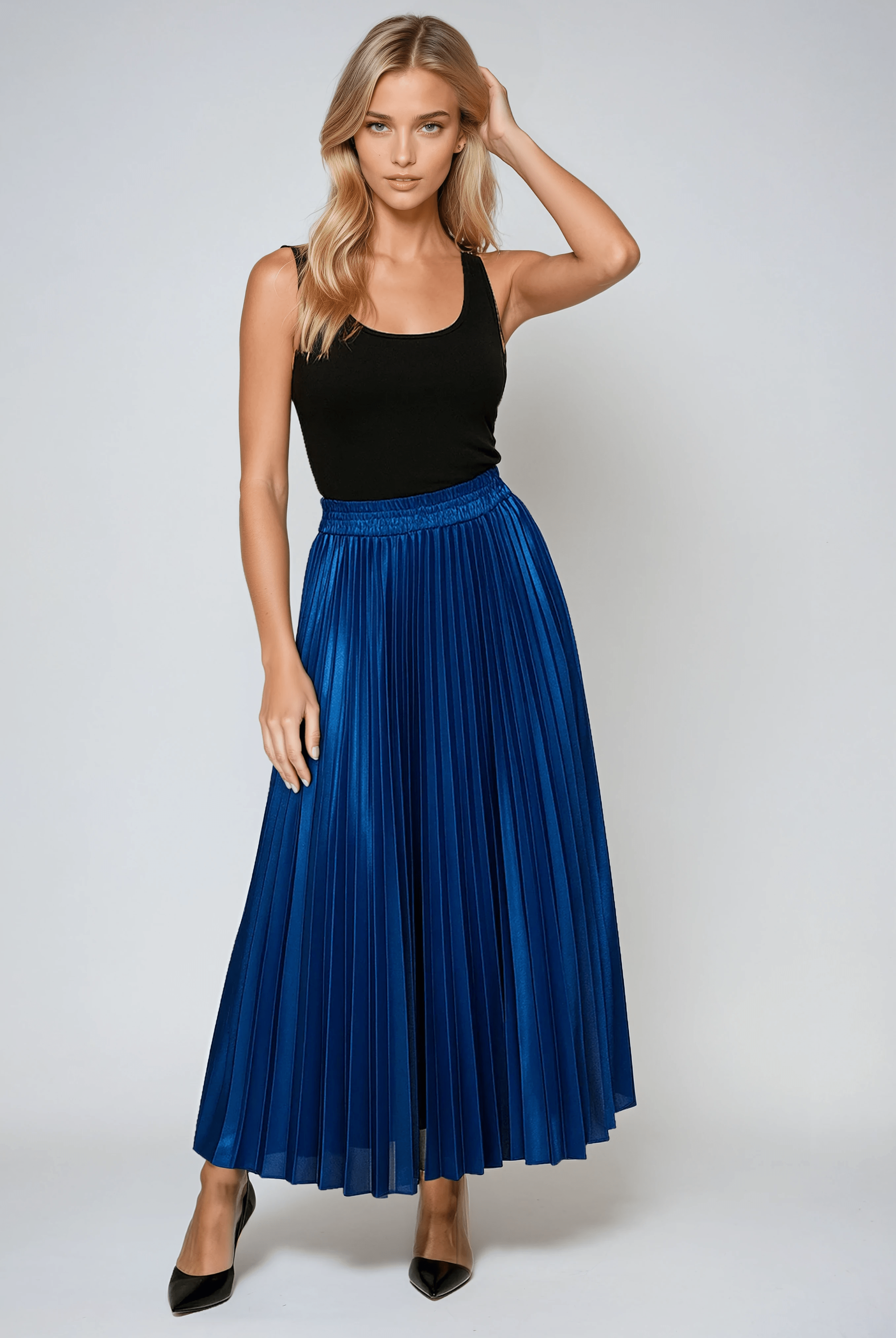 Gold high waist pleated maxi skirt from Lumina Wear, flowing and elegant with a stylish design.