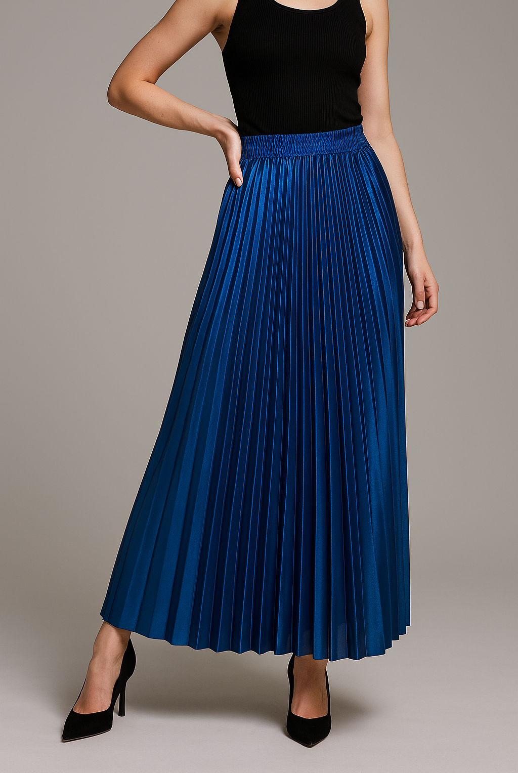 Elegant gold high waist pleated maxi skirt from Lumina Wear, showcasing flowing fabric and sophisticated design.