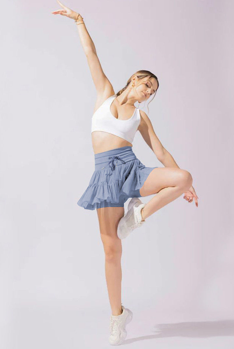 Light brown Isabella Lumina Wear pleated mini skirt with integrated shorts, stylish and elegant for casual or dressy outfits.