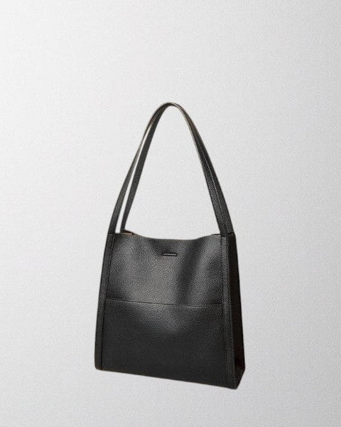 Elegant structured leather shoulder bag by Lumina Wear, featuring spacious design and brown color for stylish everyday use.