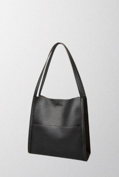 Brown Isabella Lumina structured leather shoulder bag with spacious interior, stylish design, and elegant craftsmanship.