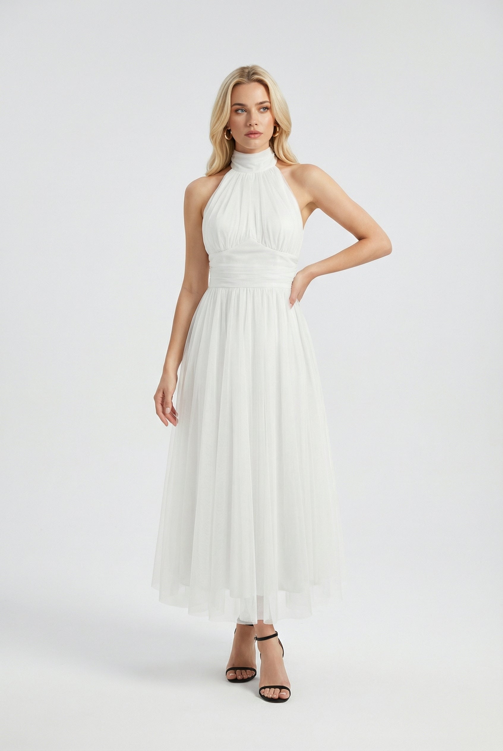 Elegant white midi dress by Lumina Wear featuring a flattering silhouette, perfect for women’s stylish occasions.
