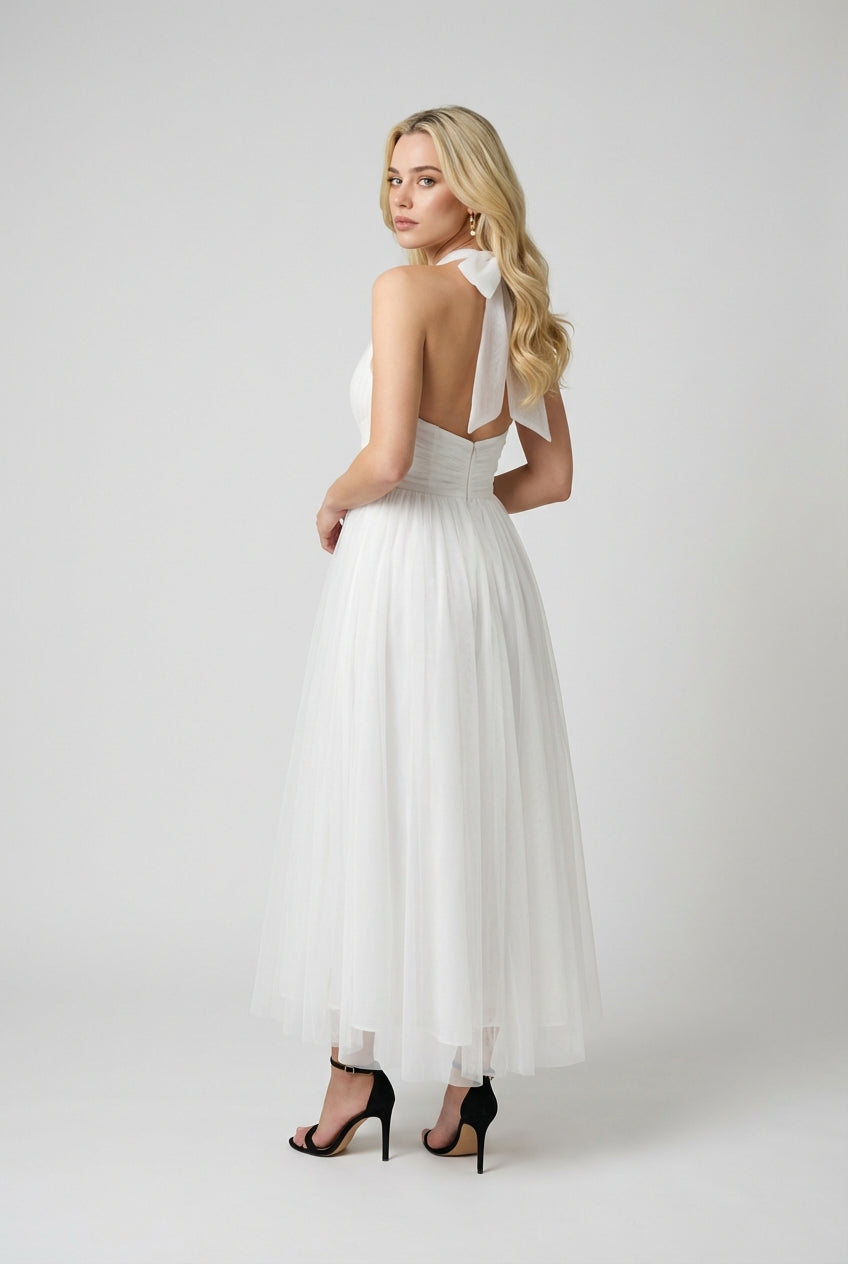 Elegant white midi dress by Lumina Wear featuring a flattering silhouette and stylish design for women's dresses.
