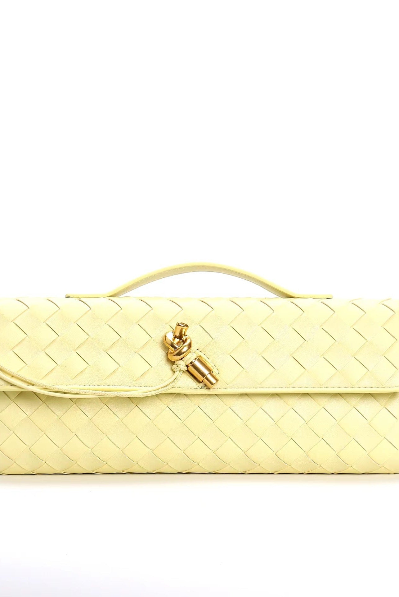 Elegant woven brown Lumina handbag with adjustable strap, showcasing stylish craftsmanship and versatile design.
