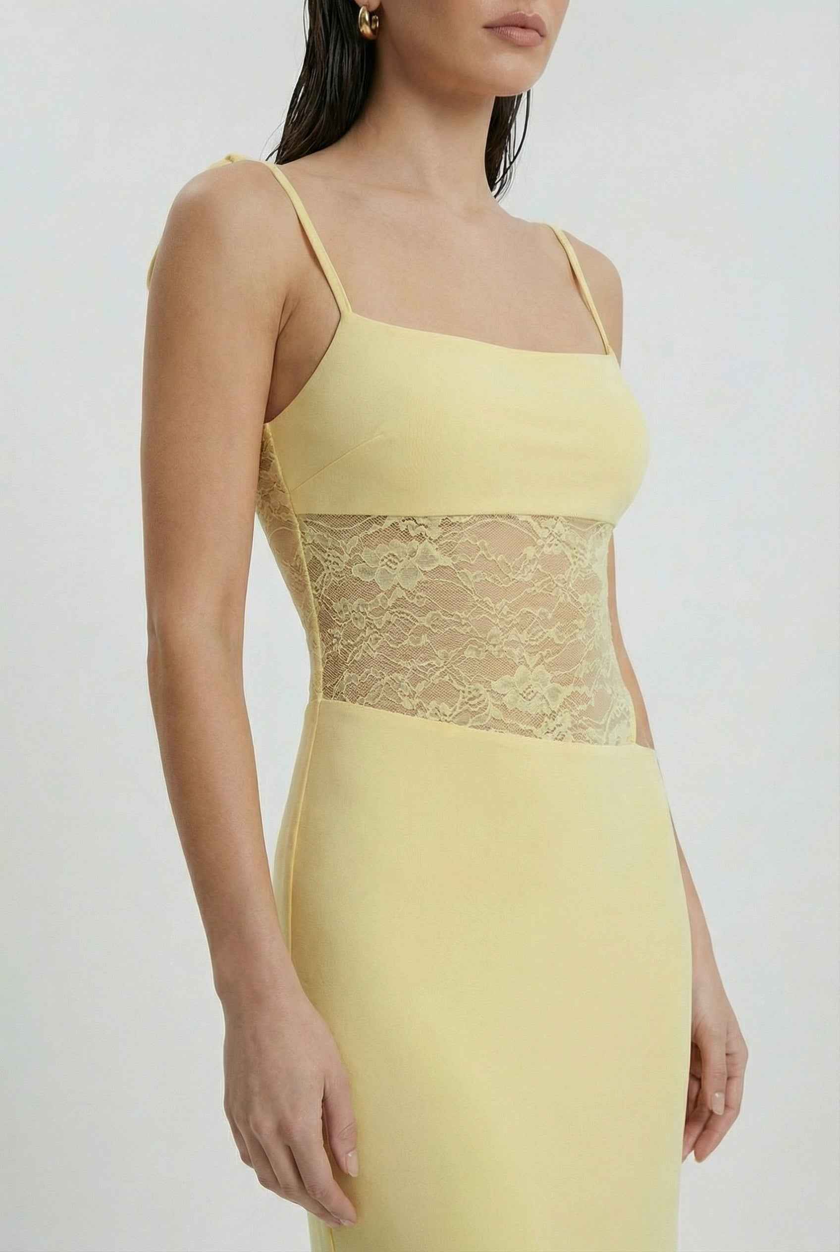 Yellow lace summer dress by Lumina Wear, featuring an elegant design and versatile fit for women's fashion.
