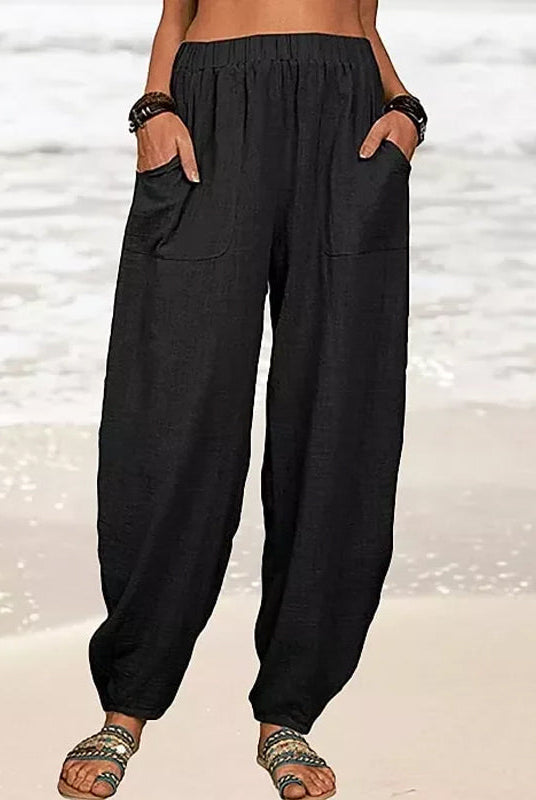 Isabella Lumina Wear high-waisted black harem trousers with casual fit, featuring relaxed style and comfortable design.