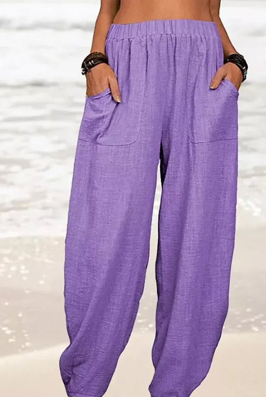 Isabella high-waisted black harem trousers by Lumina Wear featuring a casual fit and relaxed style, shown on a white background.