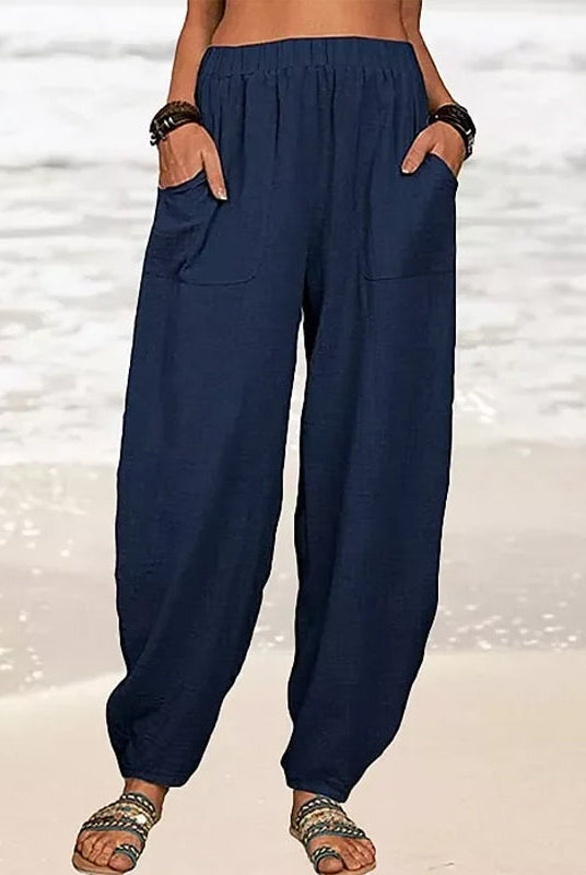 Isabella high-waisted black harem trousers by Lumina Wear with casual fit, shown in a relaxed style on a model.